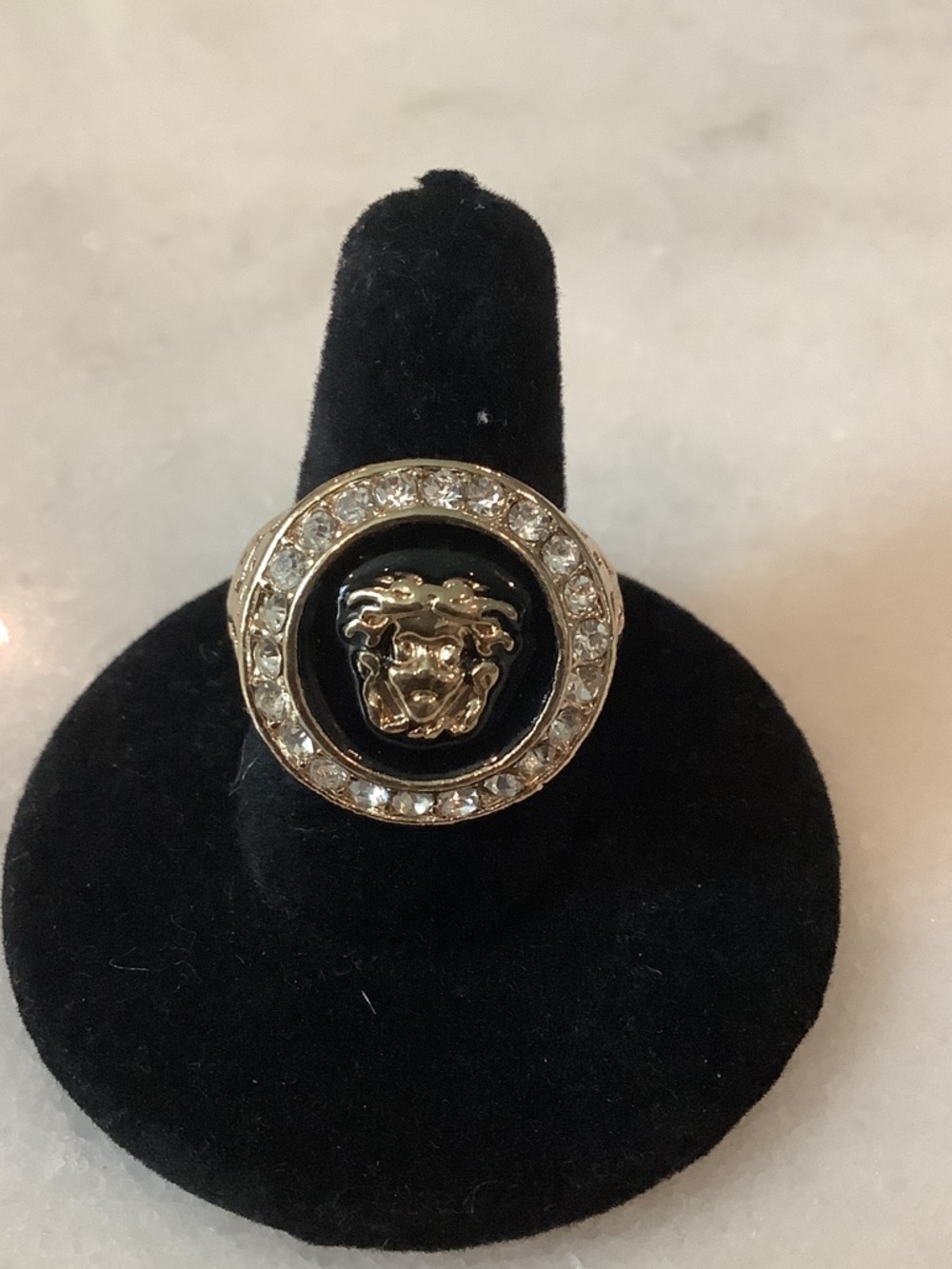 Gold-Tone Medusa Emblem Ring with Black Enamel and Crystal Halo, Brand New